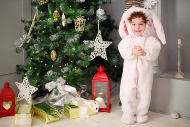 Happy little cute girl stands in bunny costume - paha_l