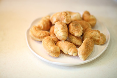 Pile of fresh and delicious mini croissants on a - paha_l