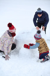 Happy mother, father and little son make snowman - paha_l