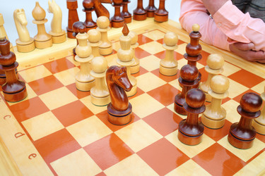 Big chessboard with black and white wood pawns - paha_l