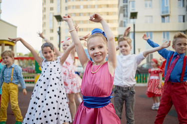 Eight little children dance at playground in - paha_l