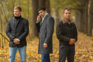 Portrait of three young men in autumn park, one - paha_l