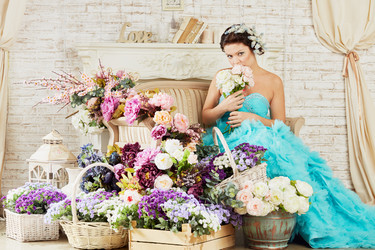 Woman in blue fluffy dress sits on couch in room - paha_l