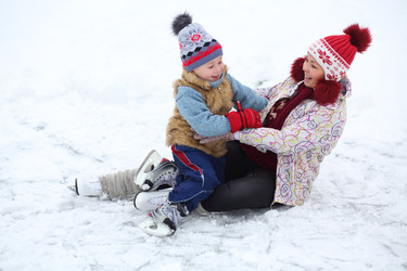 Mother and her cute little son fall during skating - paha_l