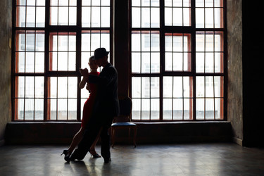 Silhouette of girl in red dress and man in black - paha_l