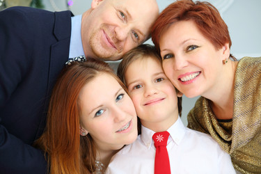 Happy beautiful mother, father and two children - paha_l