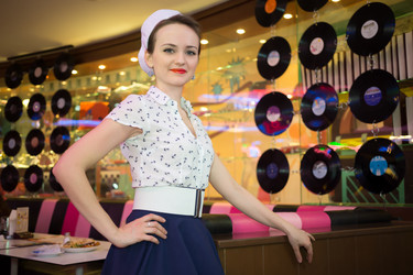 Young woman in retro dress in bar decorated - paha_l
