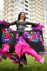 Young woman in beautiful skirt zingara dances on - paha_l
