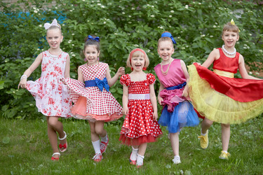 Five smiling little girls dressed in dancing suits - paha_l