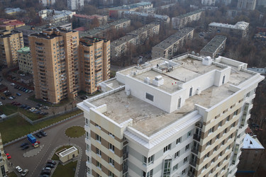 Roofs and surroundings with a high building in - paha_l