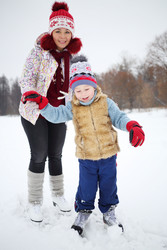 Mother and her little son learn to skating on ice - paha_l