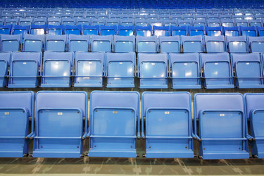 Many rows of blue empty seats with numbers in big - paha_l