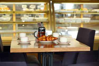 Table with four cups of tea, teapot and fresh - paha_l