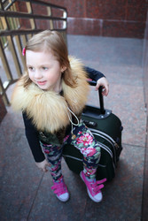 Happy little girl standing with a large green - paha_l