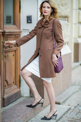 Beautiful middleaged woman in jacket opens old - paha_l
