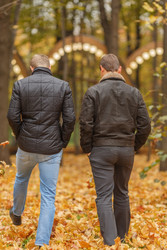 Two young man in black jacket in autumn park, view - paha_l
