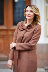 Beautiful middleaged woman in jacket stands on - paha_l