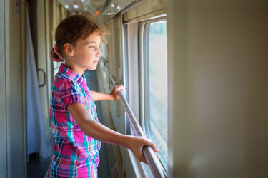 Young girl standing inside train and pensively - paha_l