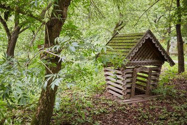 Small wooden house with mossy roof at apiary - paha_l