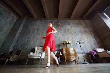 Young woman in red dress dancing tango in retro - paha_l