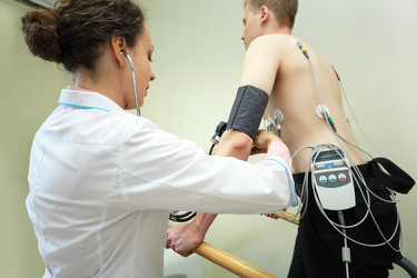 Nurse putting on cuff of device for measuring - paha_l