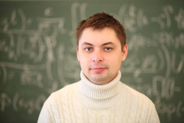 Teacher in white stands near blackboard with - paha_l
