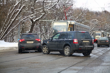 Car accident on city road with tramways at winter - paha_l