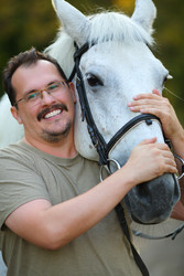 Happy smiling man in glasses hugs beautiful white - paha_l