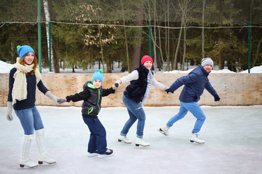 Parents and two children in the skating rink - paha_l