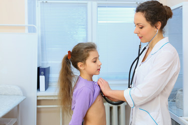 Health worker hears out girl by stethoscope in - paha_l