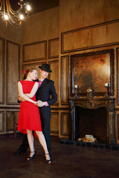 Happy handsome girl and man in black hat dancing - paha_l