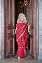 Blonde woman in red dress stands in doorway, - paha_l