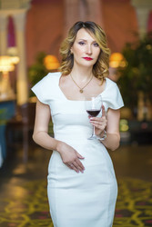 Beautiful middleaged woman in white stands with - paha_l