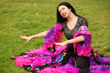 Young happy woman in beautiful skirt zingara poses - paha_l