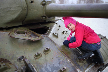 Girl in a pink jacket and hat climbed on the - paha_l
