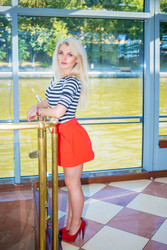 Blonde pretty woman in striped t-shirt stands near - paha_l