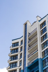 • Low angle view of modern residential architecture with blue and white facade elements. City - Pazemin