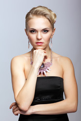 Blonde woman in black dress and necklace - Serg Zastavkin