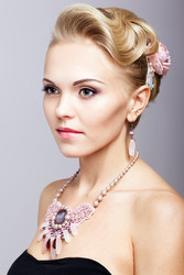 Blonde woman in black dress and necklace - Serg Zastavkin