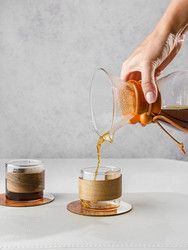 Preparing coffee in a pour‑over coffee maker - JuliaLavleis