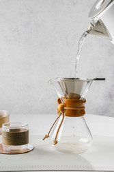 Preparing coffee in a pour‑over coffee maker - JuliaLavleis